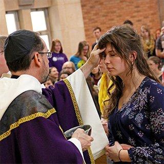 Abbot James administering ashes 